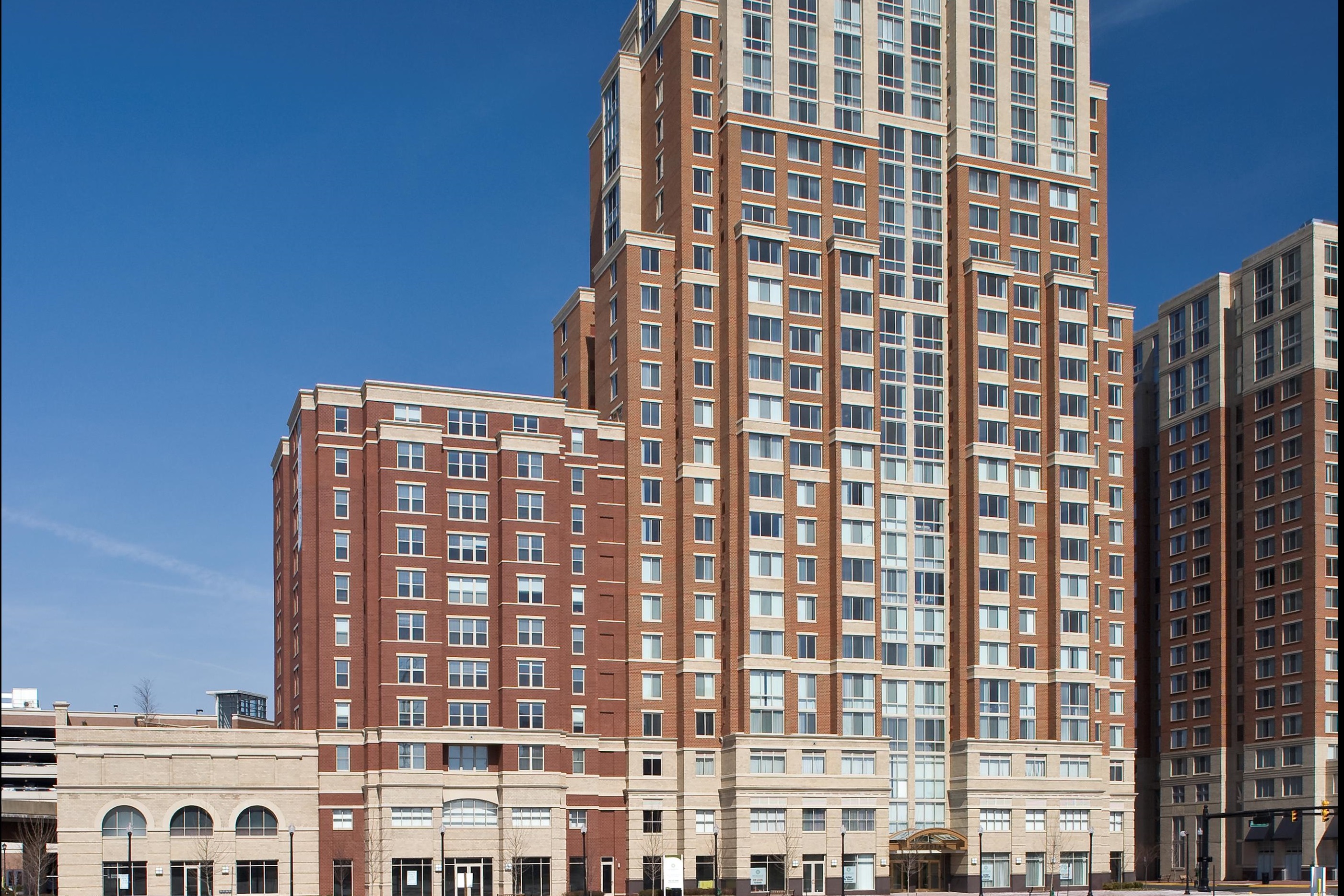 Exterior view of The Meridian at Eisenhower Station, a multi-story residential building featuring detailed masonry work completed by JD Long Masonry.